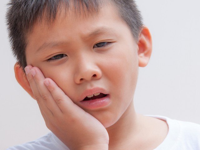what causes children to grind teeth