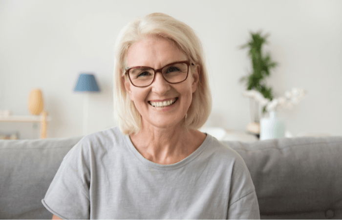 woman smiling after getting dental implants at Brunel Dental Practice in Swindon